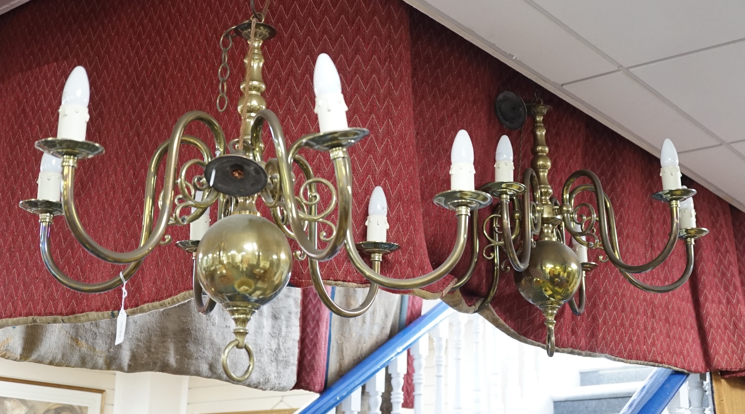 A pair of Dutch twin branch brass electroliers, 59cm high